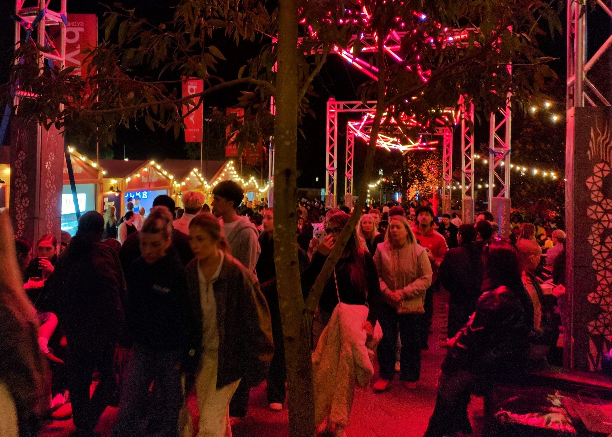 A dense crowd moves through Vivid Sydney in 2026.